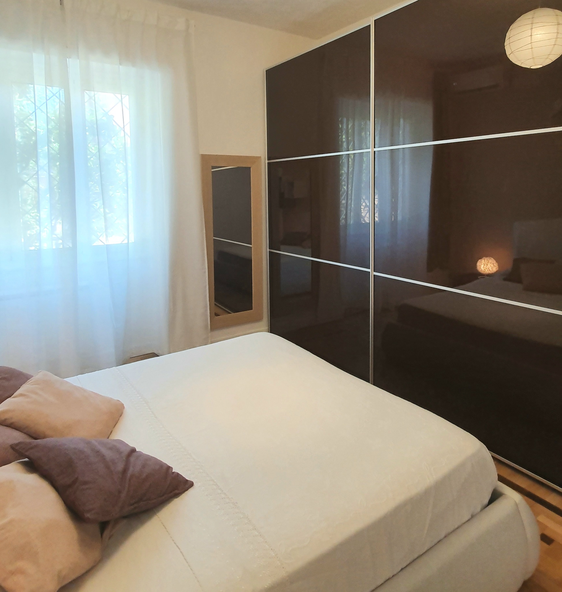 Bright main bedroom with large wardrobe