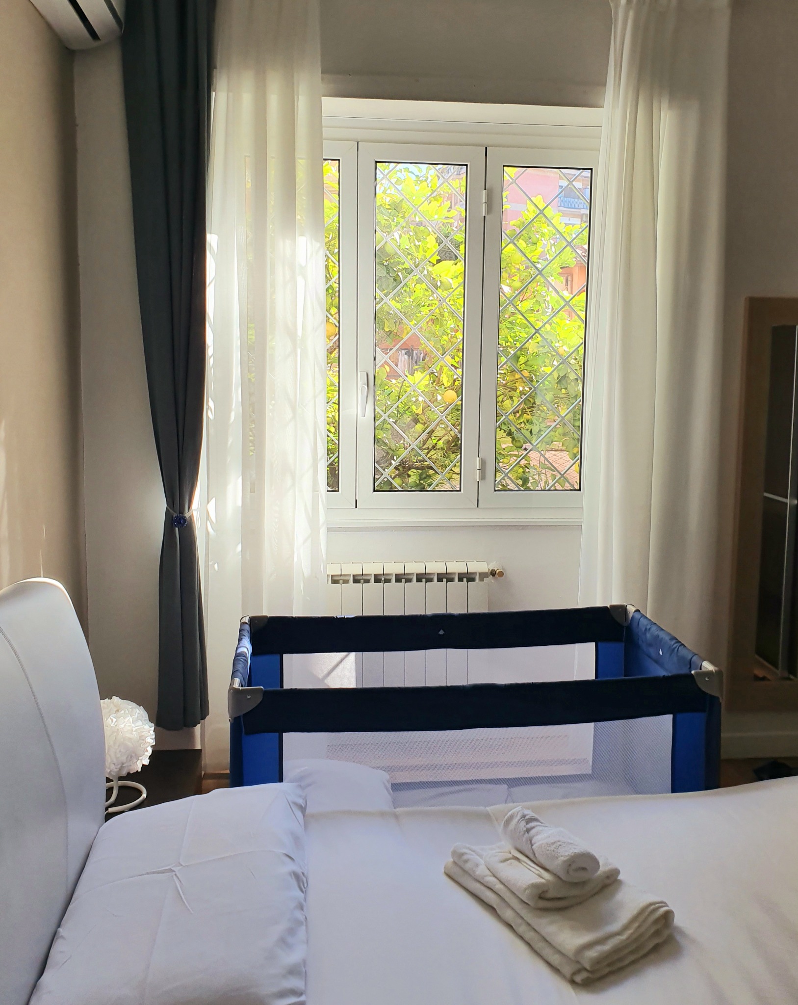 Bedroom window and baby cot